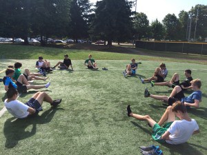 The boy's team participates in supplementary exercises meant to develop strength and prevent injuries.