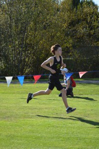 Junior Matthew Gaspar dashes to the finish at the Twilight Invitational. Photo by Nathan Smith