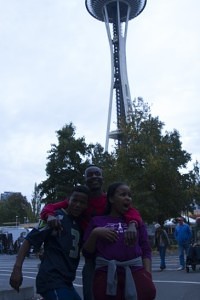 From right to left: Lengz, Sizla, and Yolanda in front of Seattle's iconic Space Needle