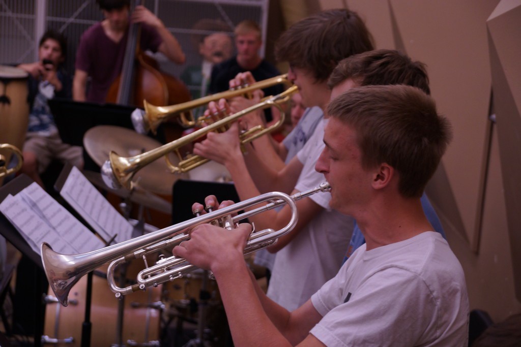 Junior Thomas Hinds rehearses alongside the rest of the trumpet section. Photo by Conor Courtney