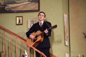 Junior Duncan Weinland pays the guitar at the Thursday Night performance. Photo by Nathan Smith